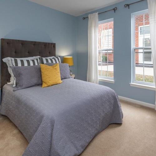 Bedroom bedroom with a large window and modern decor