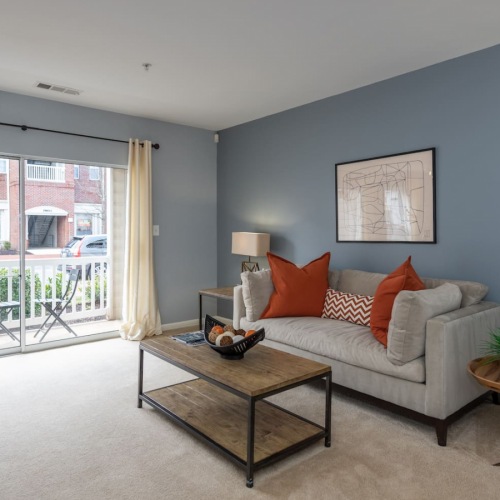 9’ Ceilings living room with large amount of natural lighting through large windows
